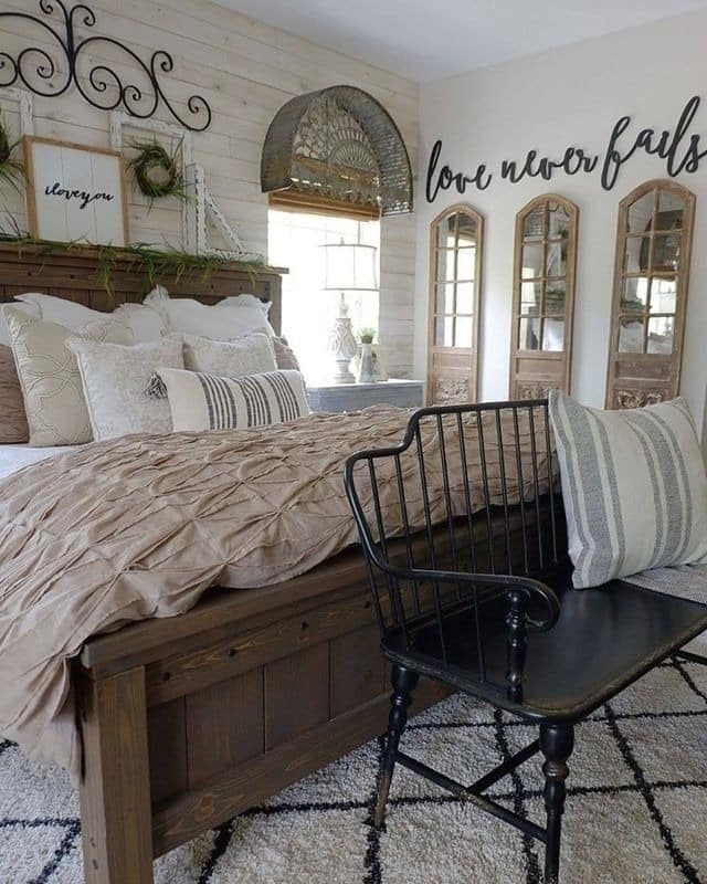 11. Rustic Taupe Farmhouse Bedroom with Black Iron Accents - farmhouse bedroom ideas