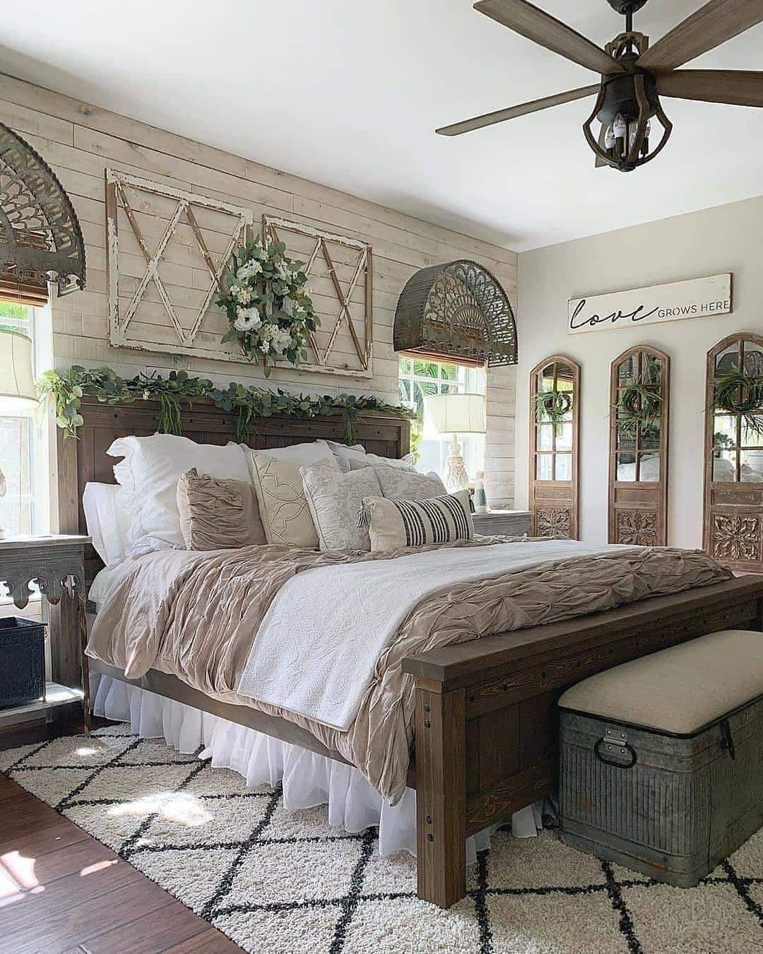 20. Layered Neutral Farmhouse Bedroom with Vintage Decor - farmhouse bedroom ideas