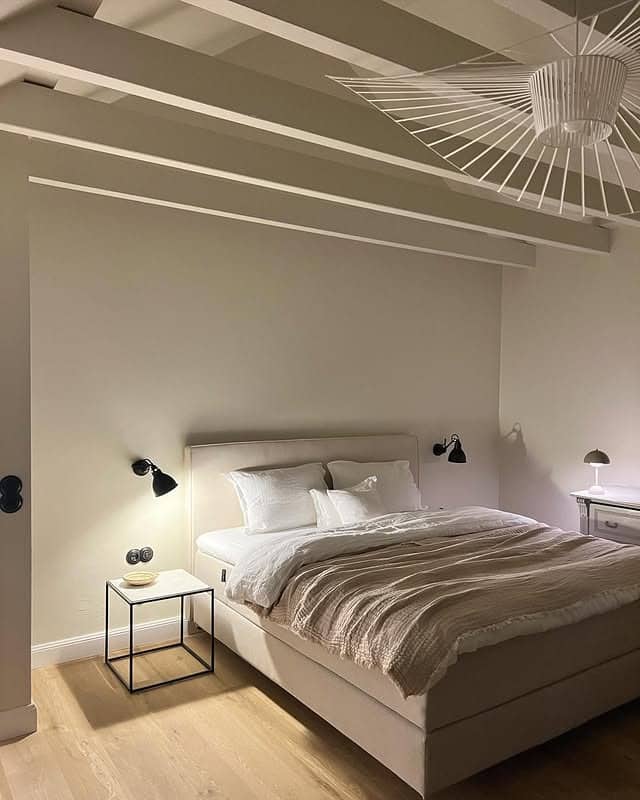 11. Minimal Beige Bedroom with Architectural Ceiling Beams - beige bedroom ideas