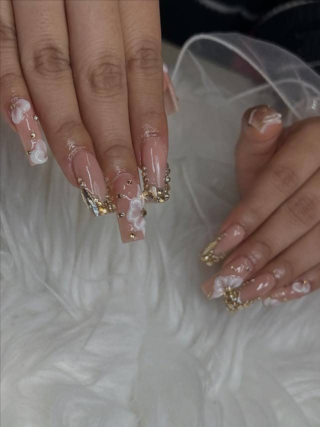 16. Nude Coffin Nails with Gold Crystal Tips - coffin nail ideas