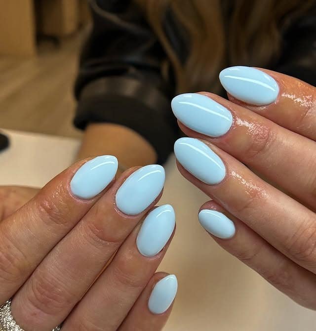 12. Powder Blue Gloss Almond Nails - winter almond nail ideas