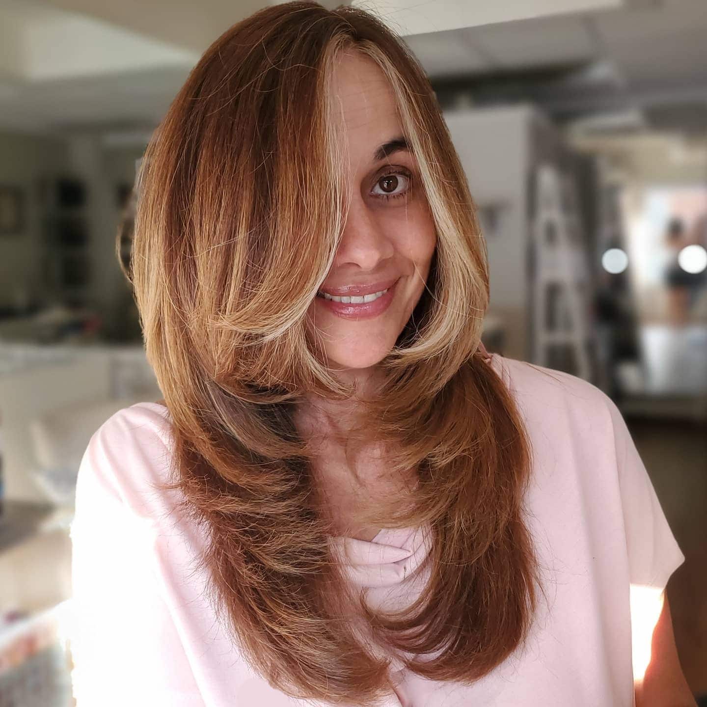 7. Layered Feather Blowout with Honey Blonde Balayage - Feather Haircut