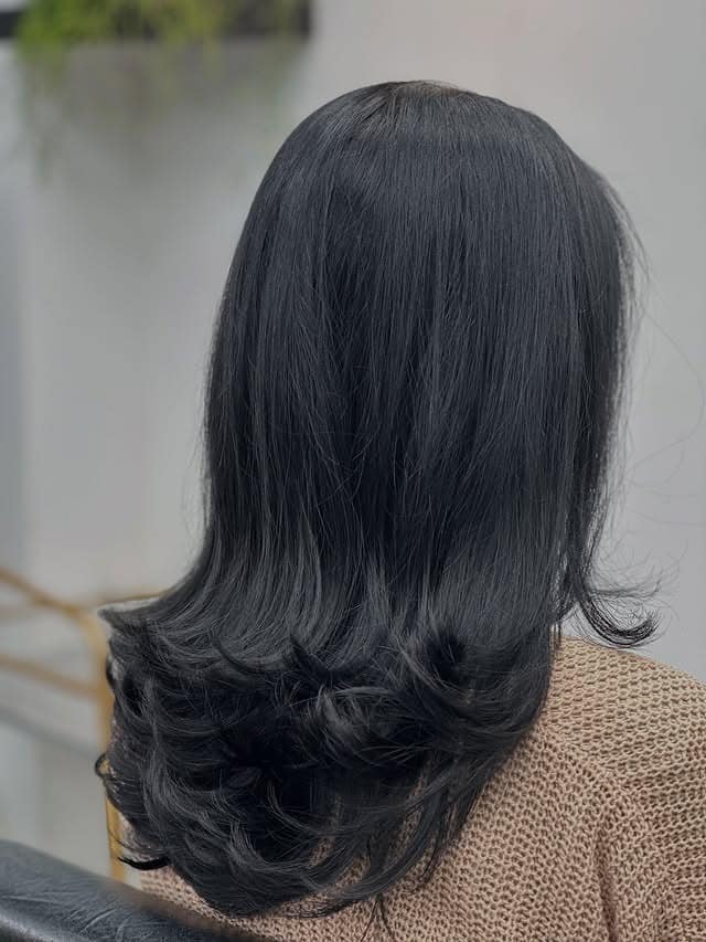 12. Long Feather Blowout with Natural Black Hair - Feather Haircut