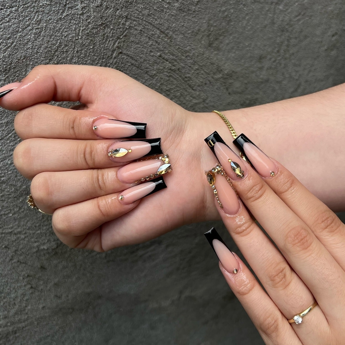 3. Nude and Black Coffin Nails with Gold Gems - short black coffin nail ideas