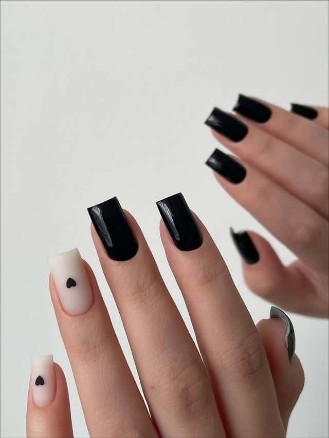 6. Black and White Heart Accent Coffin Nails - short black coffin nail ideas