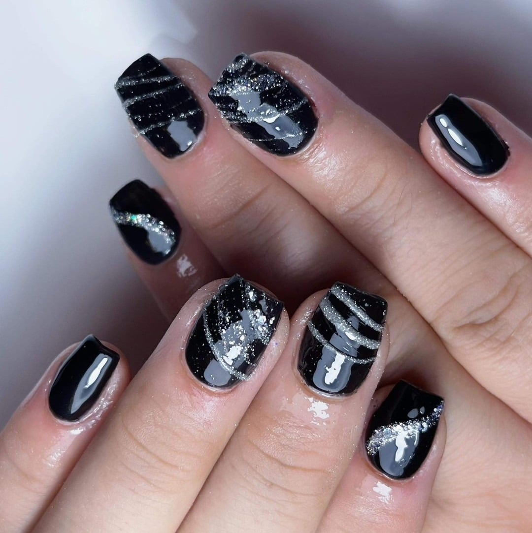 7. Black Glitter Accent Short Nails - short black coffin nail ideas