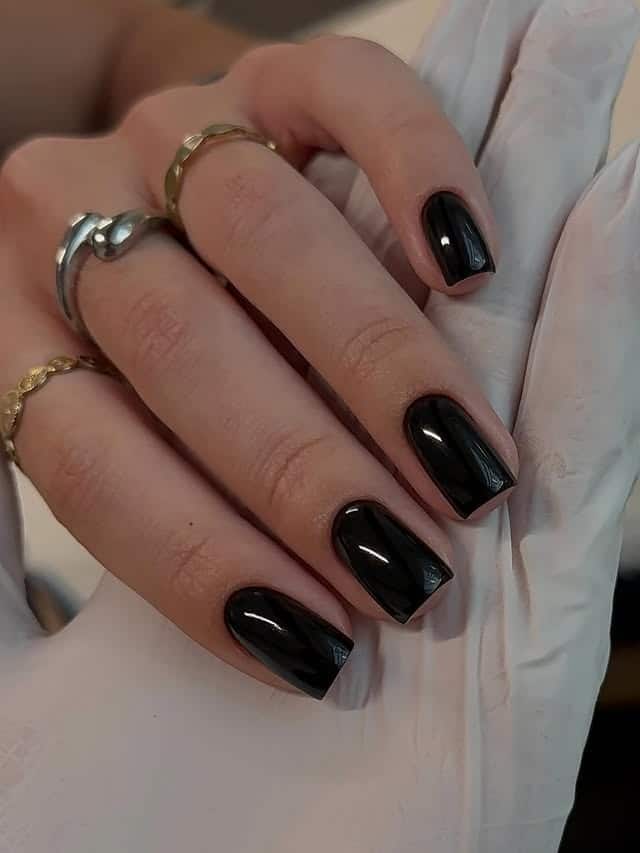 11. Glossy Black Short Coffin Nails - short black coffin nail ideas