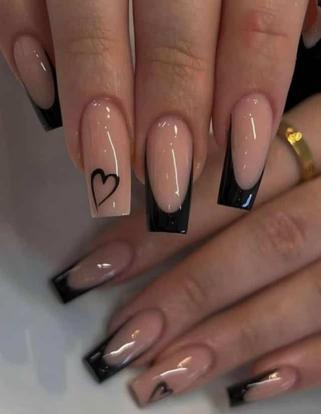 12. Nude and Black French Tip Coffin Nails with Heart Art - short black coffin nail ideas