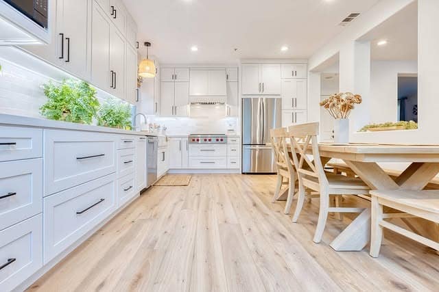2. Bright White Kitchen With Light Oak Flooring - white kitchen ideas