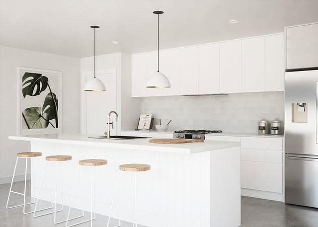4. Minimal White Kitchen With Soft Gray Finishes - white kitchen ideas