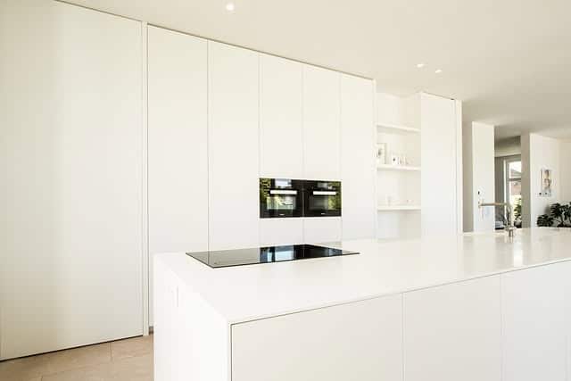 15. Minimalist White Kitchen With Seamless Storage - white kitchen ideas