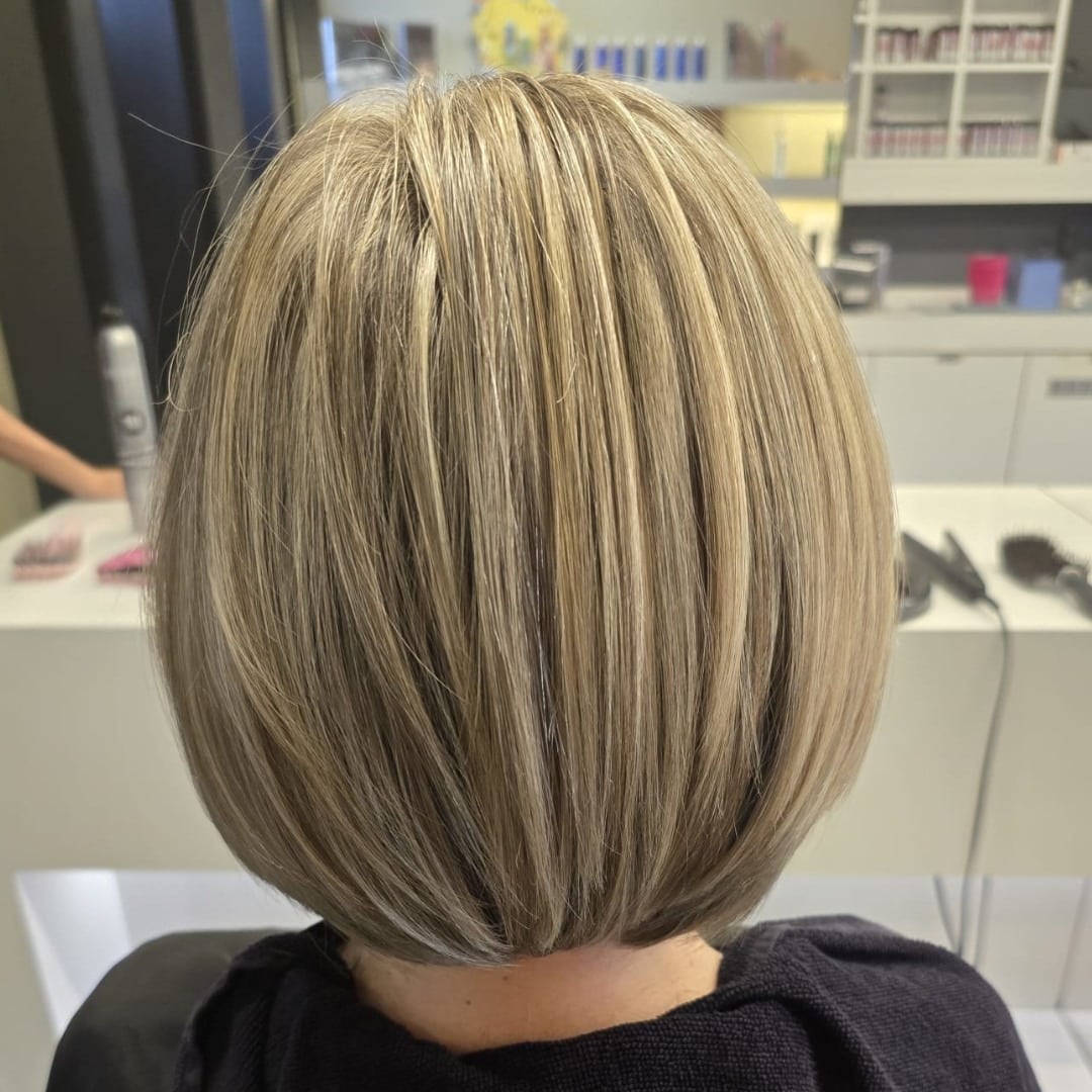 1. Sleek Champagne Blonde Precision Bob - Classic Bob Cut