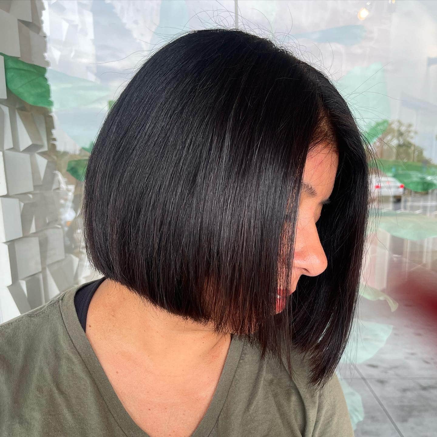 4. Glossy Jet Black Angled Bob - Classic Bob Cut