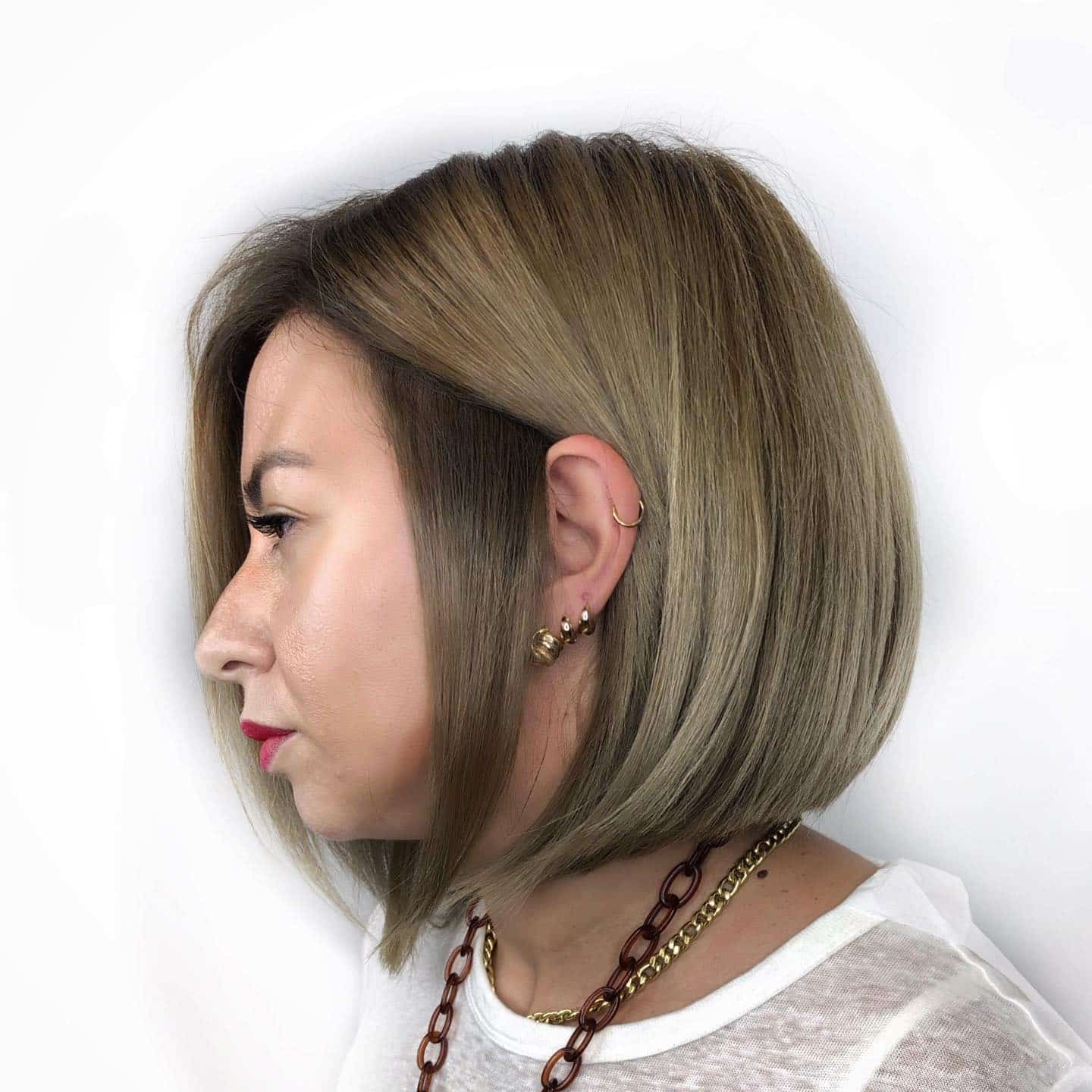 20. Soft Cocoa French Bob with Curtain Bangs - Classic Bob Cut