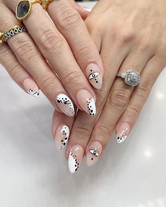 7. Evil Eye Black and White Almond Nails - black and white nail ideas