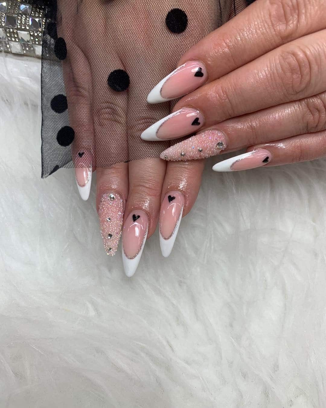 8. White French Stiletto Nails with Crystal Accent - black and white nail ideas