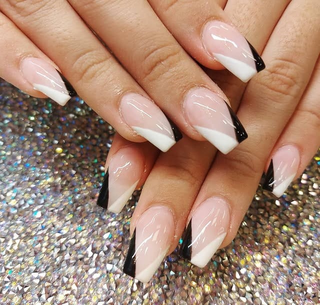 9. Black and White Angled French Tip Nails - black and white nail ideas