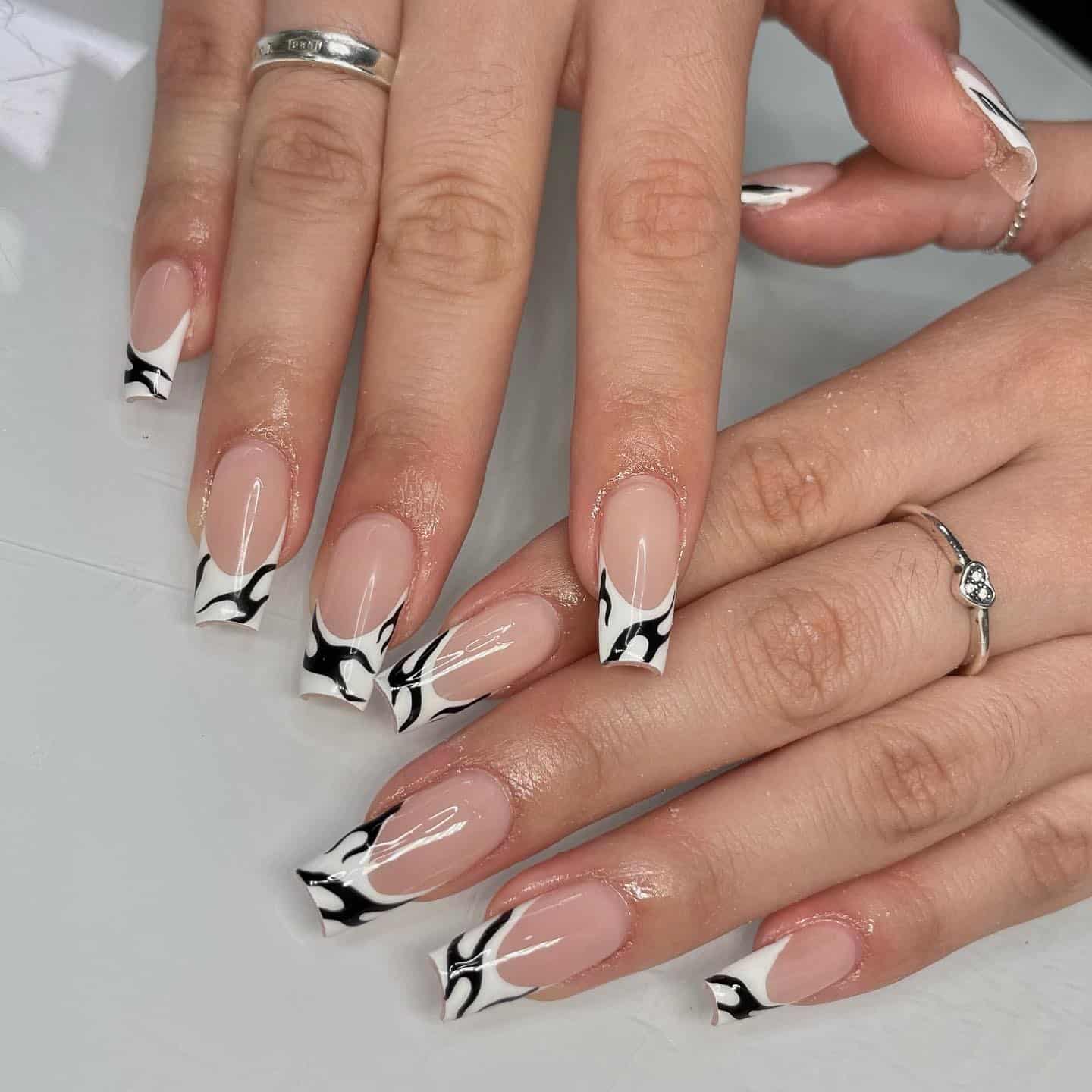 12. Abstract Black and White French Tip Coffin Nails - black and white nail ideas