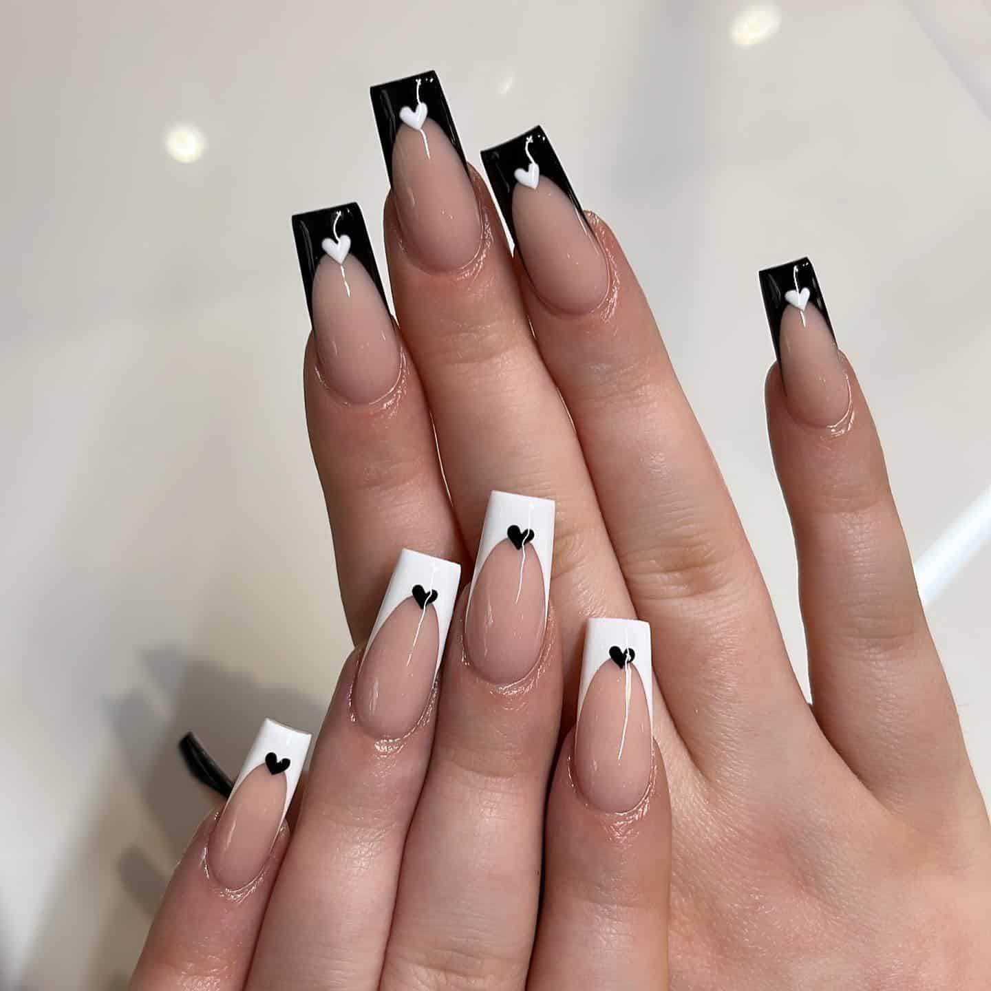 18. Black and White Heart French Tip Nails - black and white nail ideas