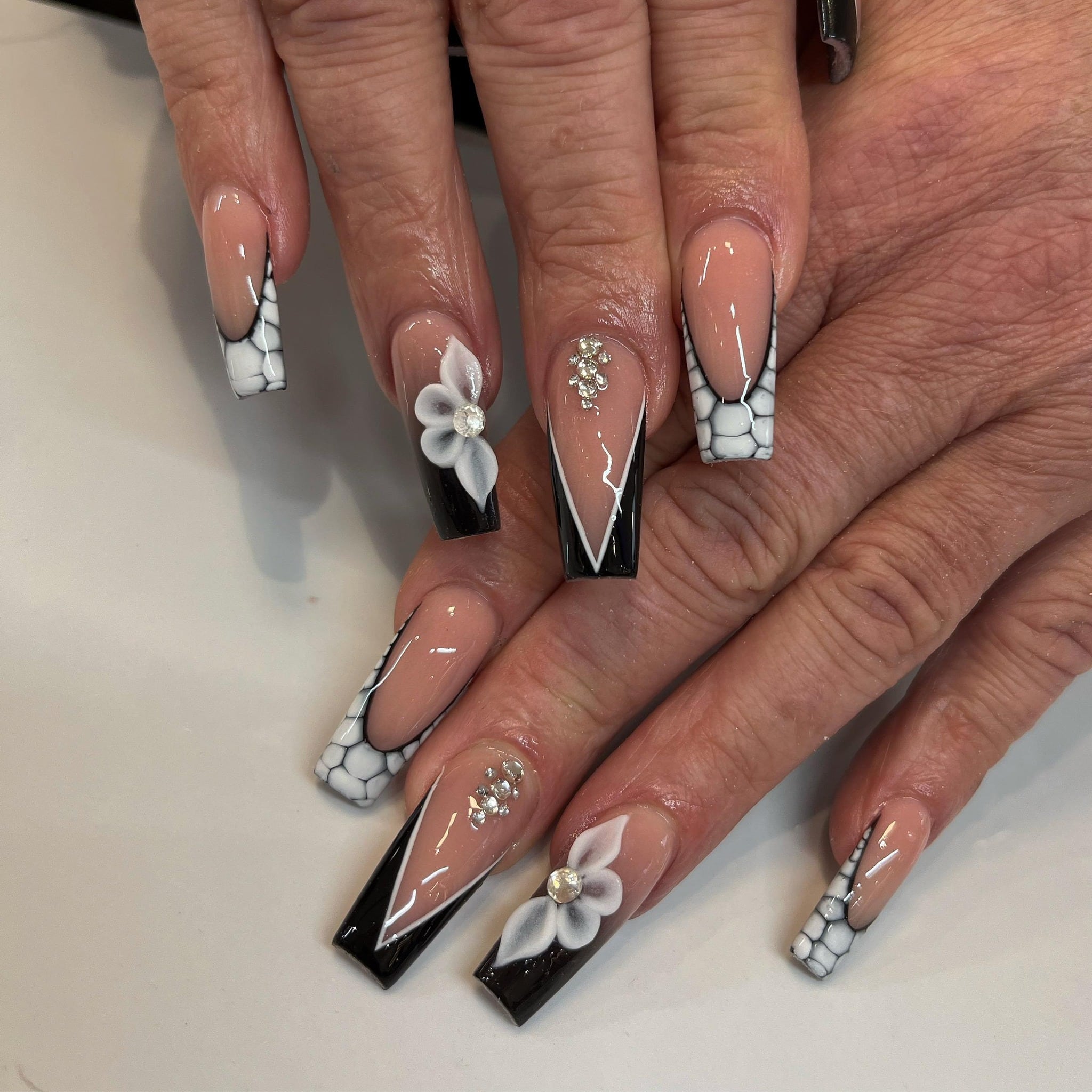 20. Black and White Floral Marble Coffin Nails - black and white nail ideas
