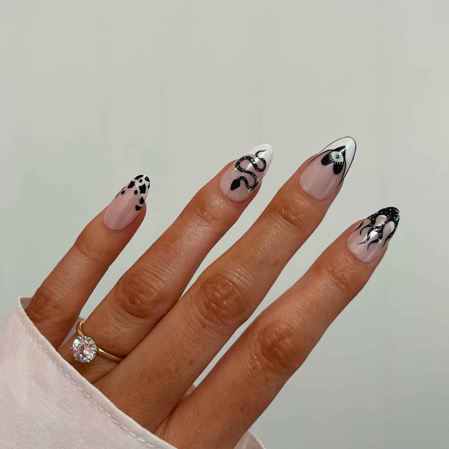 21. Black and White Celestial Almond Nails - black and white nail ideas