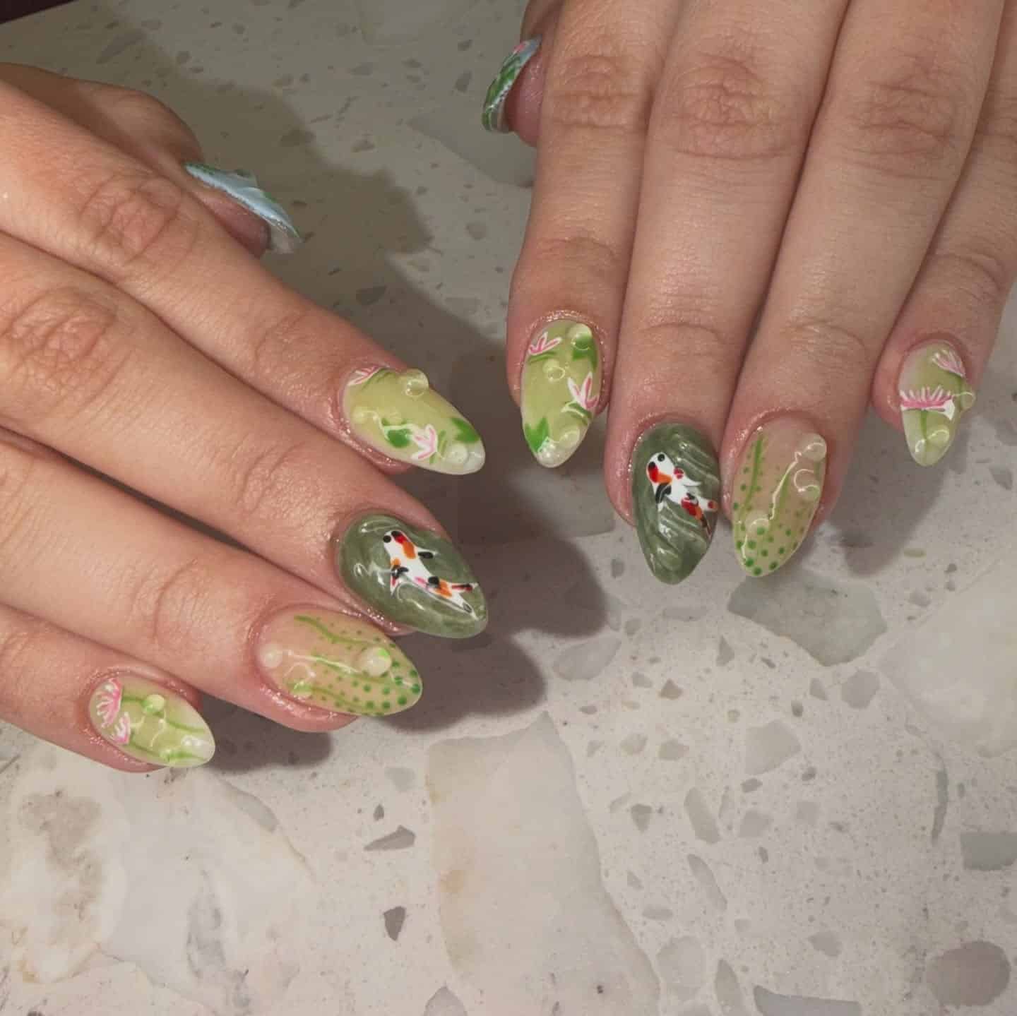 4. Sage Green Koi Pond Almond Nails - nature nail ideas