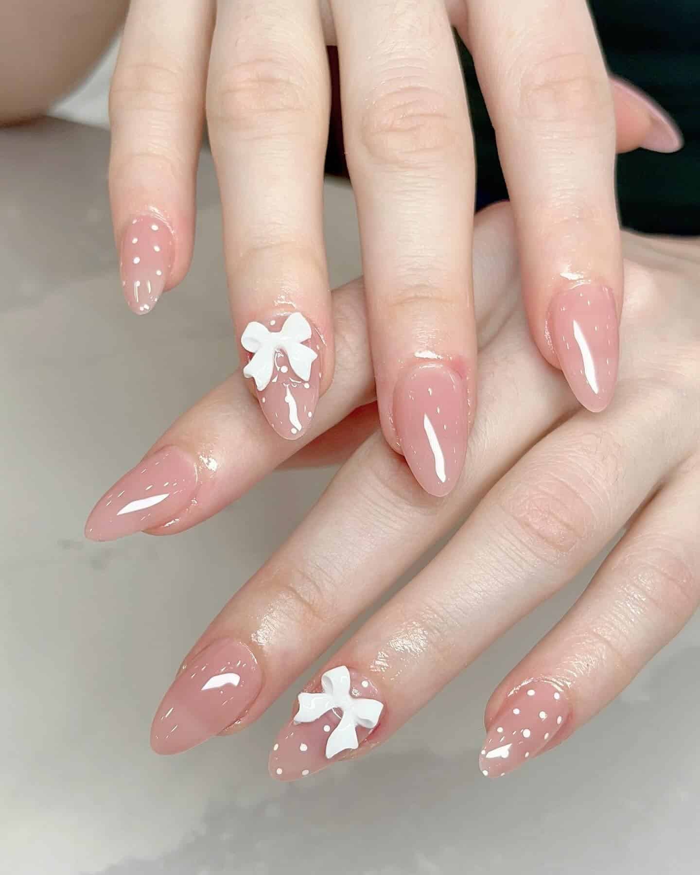 7. Nude Pink Bow Almond Nails - nature nail ideas