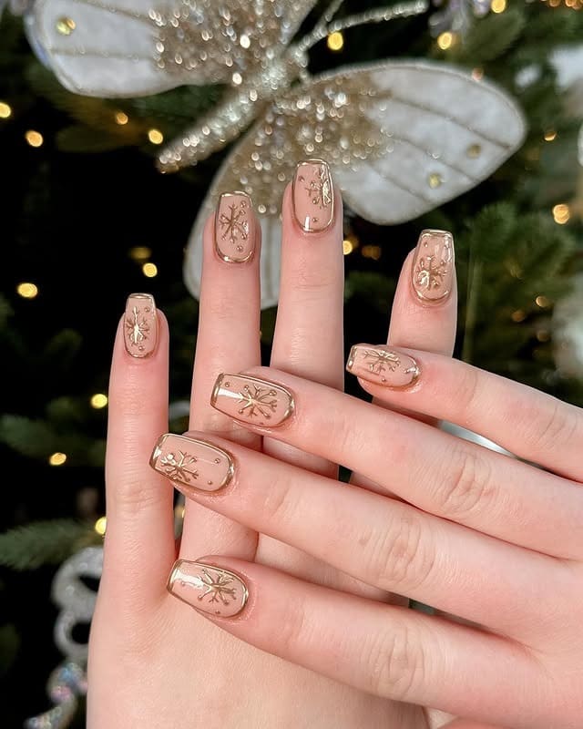 9. Gold Snowflake Nude Square Nails - nature nail ideas