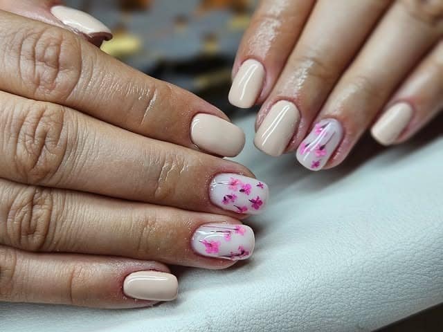 19. Nude Pink Cherry Blossom Short Nails - nature nail ideas