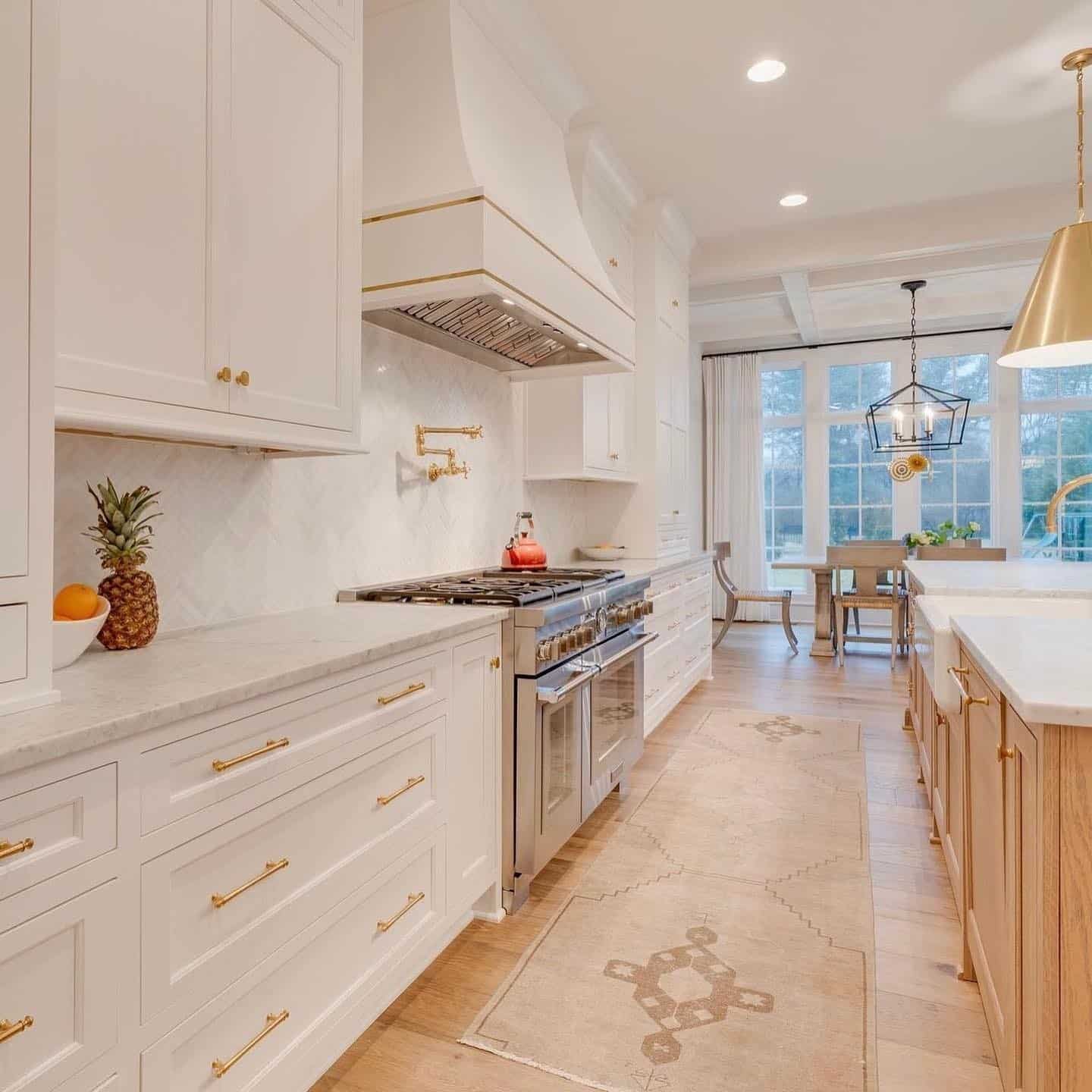 3. White and Gold Kitchen With Natural Wood Island Accents - white and gold kitchen ideas