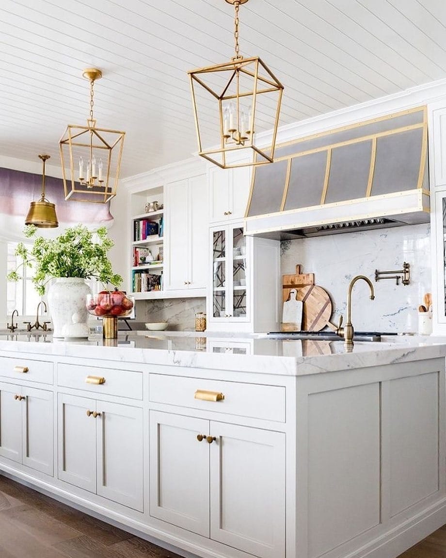 6. White Marble Kitchen With Brass Range Hood Details - white and gold kitchen ideas