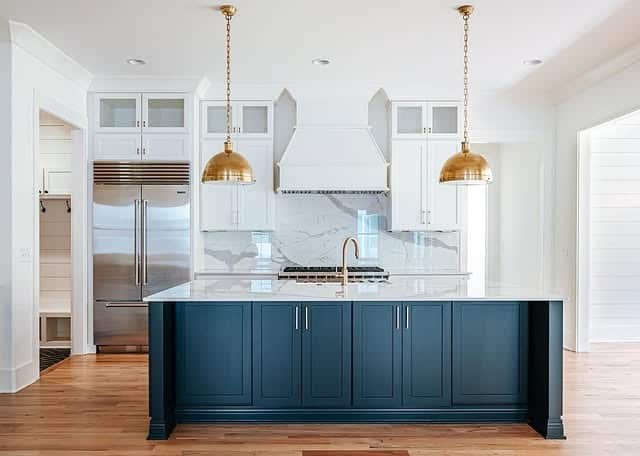 7. Navy and White Kitchen With Gold Dome Pendants - white and gold kitchen ideas
