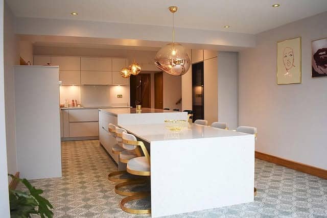 12. Modern White and Gold Kitchen With Blush Accents - white and gold kitchen ideas