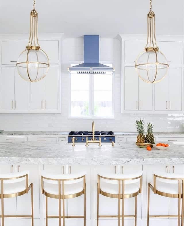 21. White and Blue Kitchen With Gold Globe Pendants - white and gold kitchen ideas