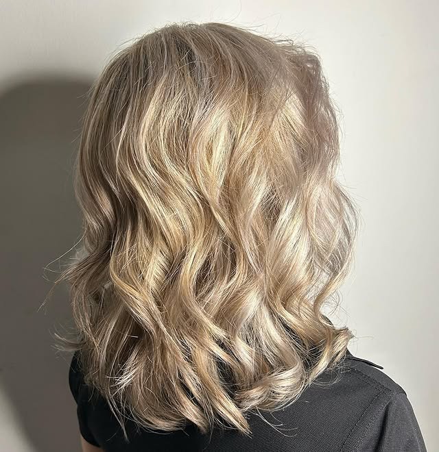 10. Soft Pearl Blonde Wavy Lob - Pearl Blonde Hair Color