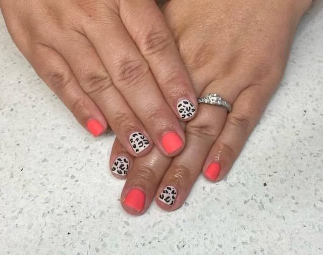 7. Neon Coral Leopard Short Nails - cheetah nail ideas