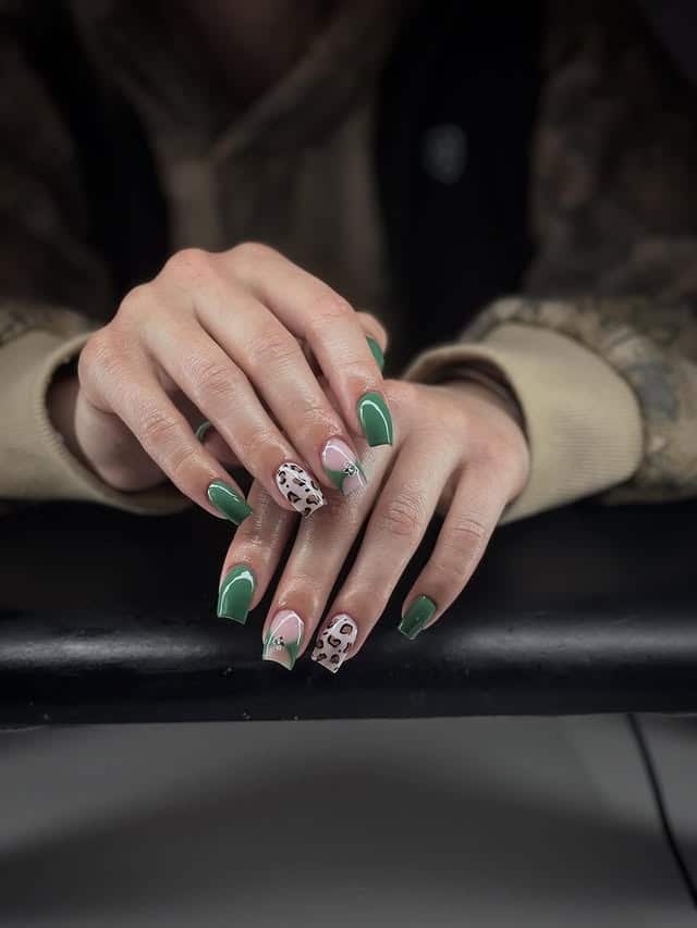 9. Sage Green Leopard Accent Nails - cheetah nail ideas