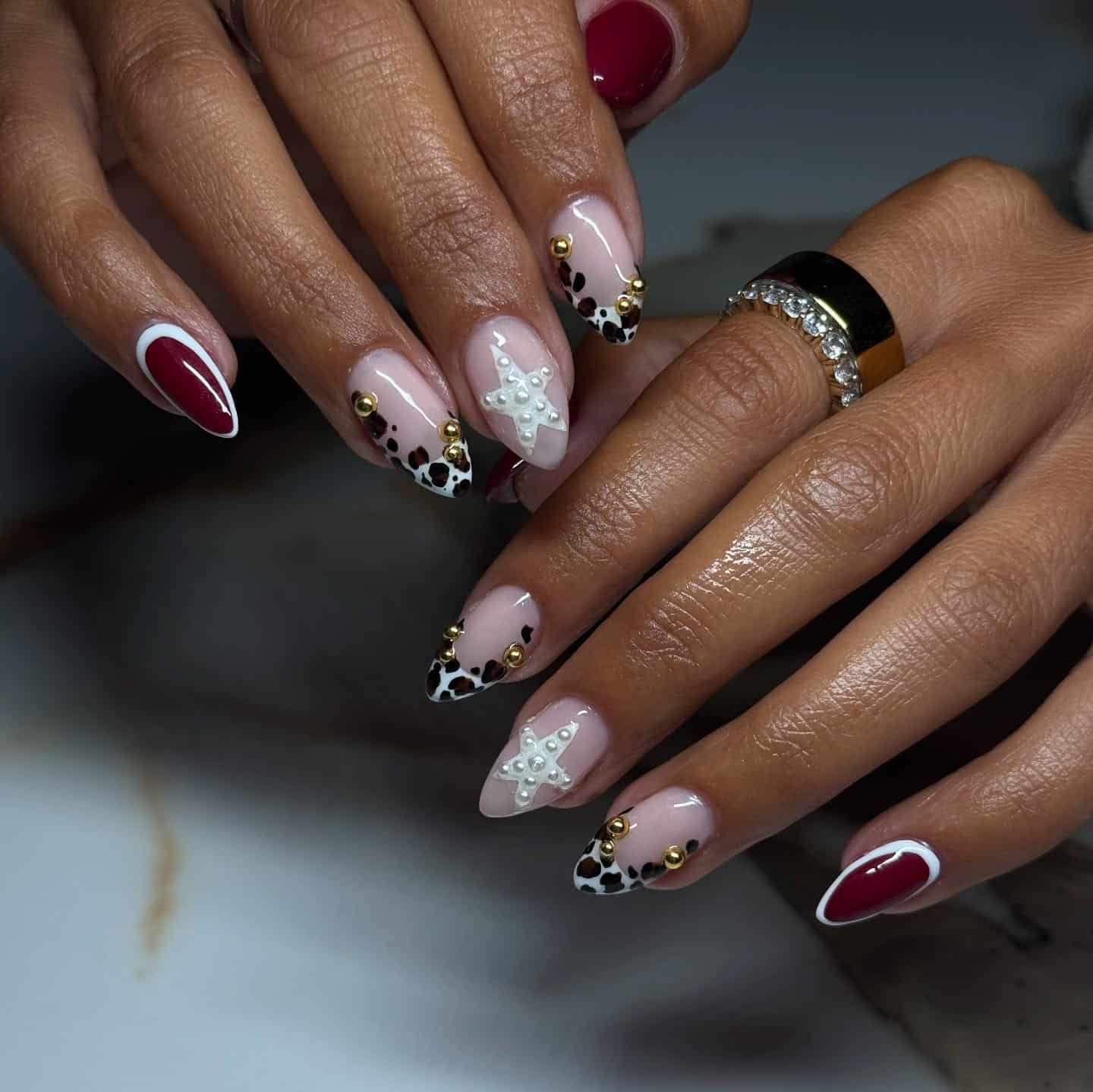 12. Burgundy Leopard Pearl Almond Nails - cheetah nail ideas