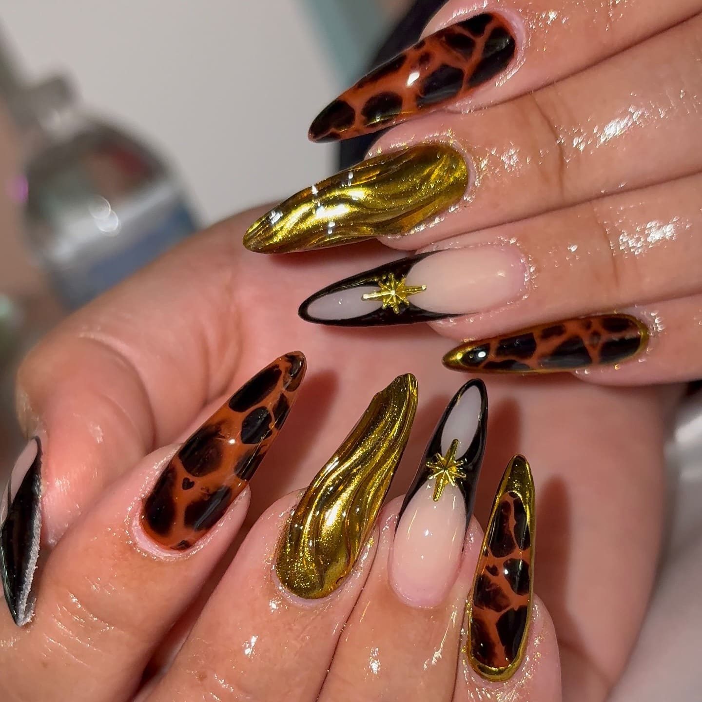19. Gold Chrome Leopard Stiletto Nails - cheetah nail ideas