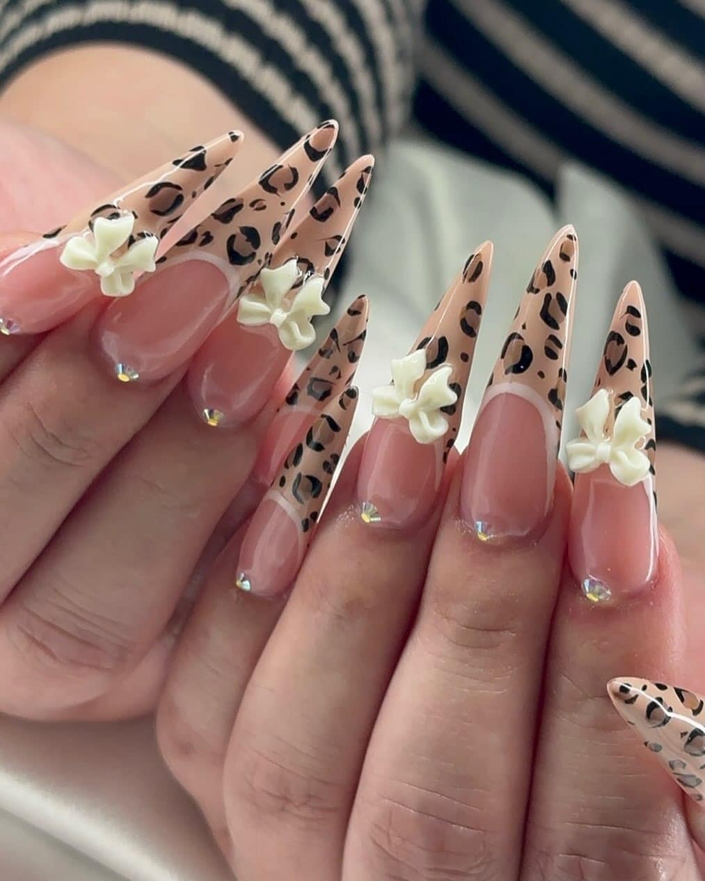 21. Nude Leopard Stiletto Bow Nails - cheetah nail ideas
