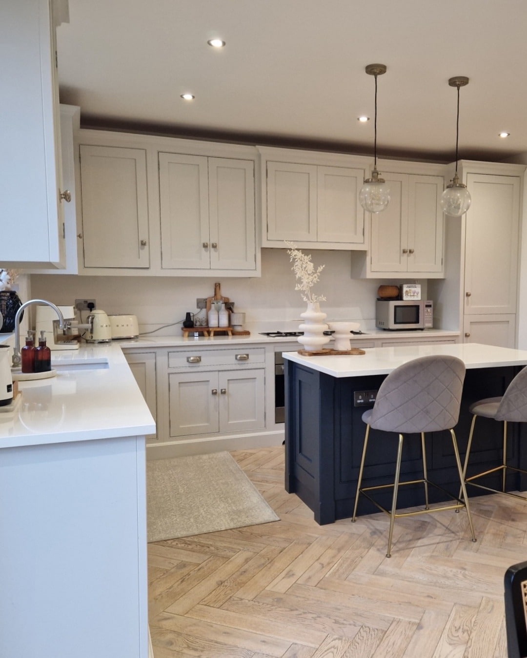 1. Soft Ivory Traditional Kitchen with Navy Island Accents - traditional kitchen ideas