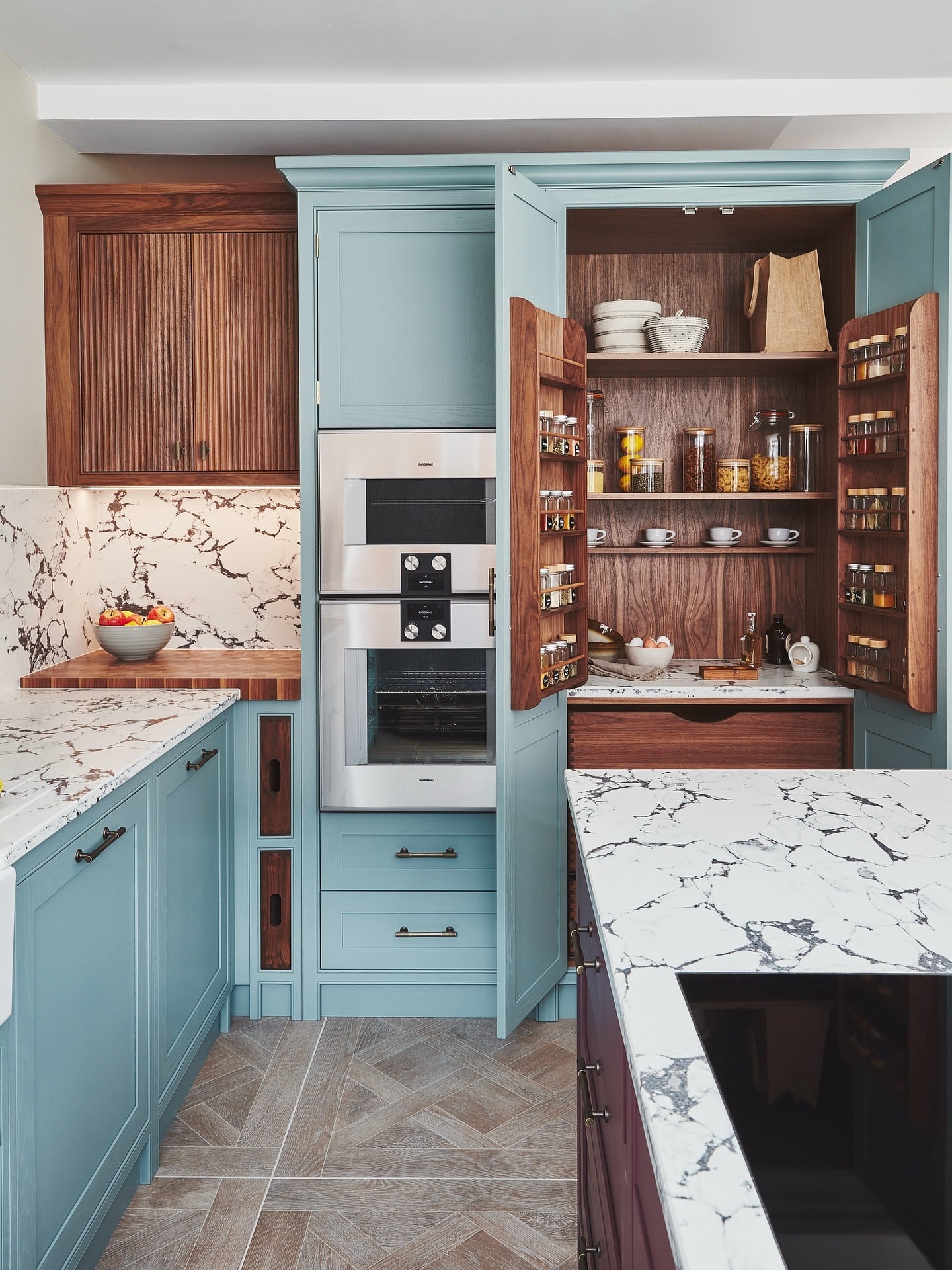 3. Powder Blue Traditional Kitchen with Walnut Pantry Interior - traditional kitchen ideas