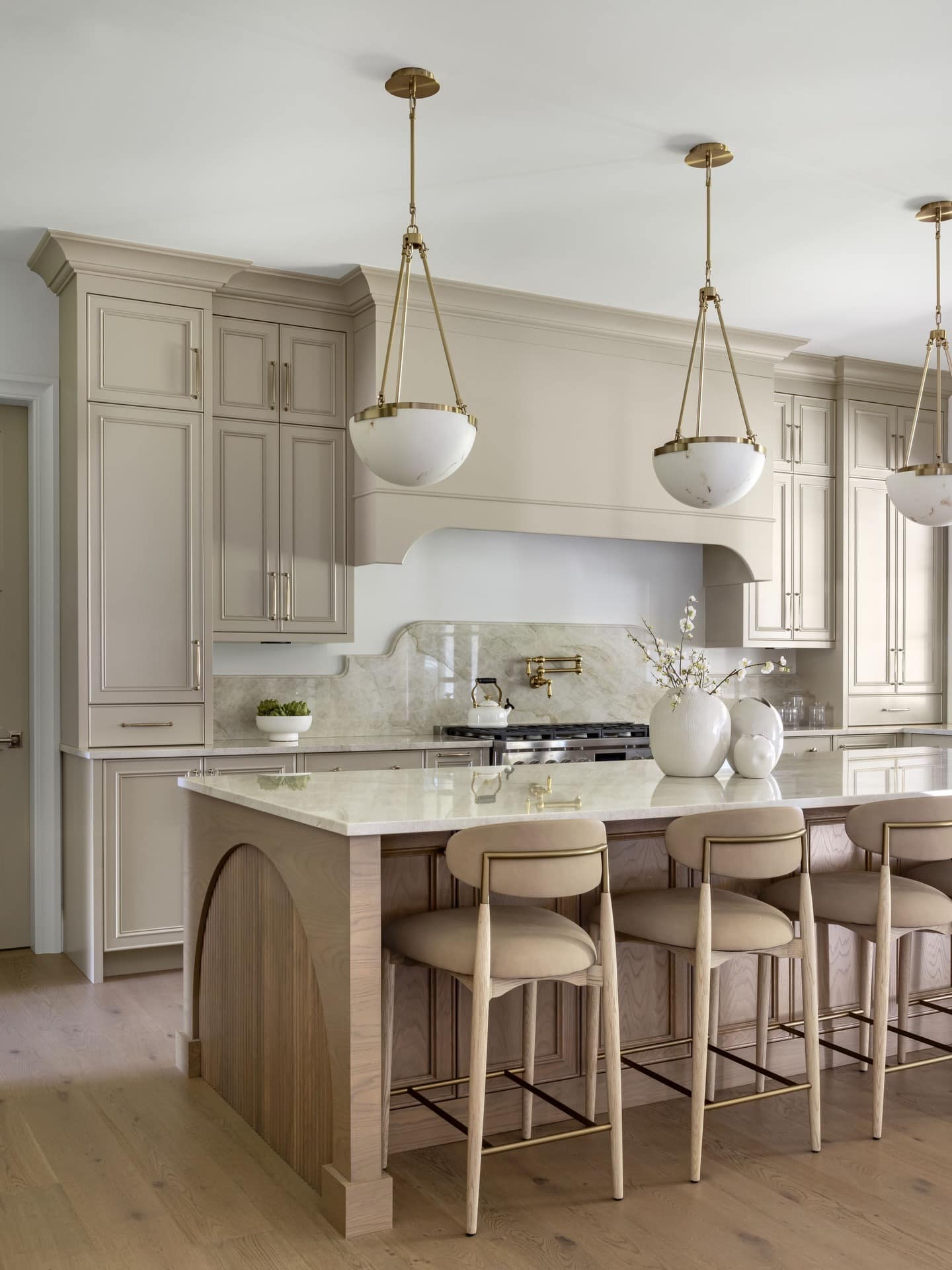 9. Taupe Traditional Kitchen with Marble and Gold Details - traditional kitchen ideas
