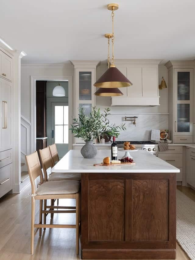 10. Cream Traditional Kitchen with Walnut Island and Statement Pendants - traditional kitchen ideas