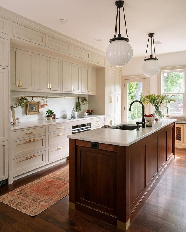 17. Warm Ivory Traditional Kitchen with Walnut Island - traditional kitchen ideas