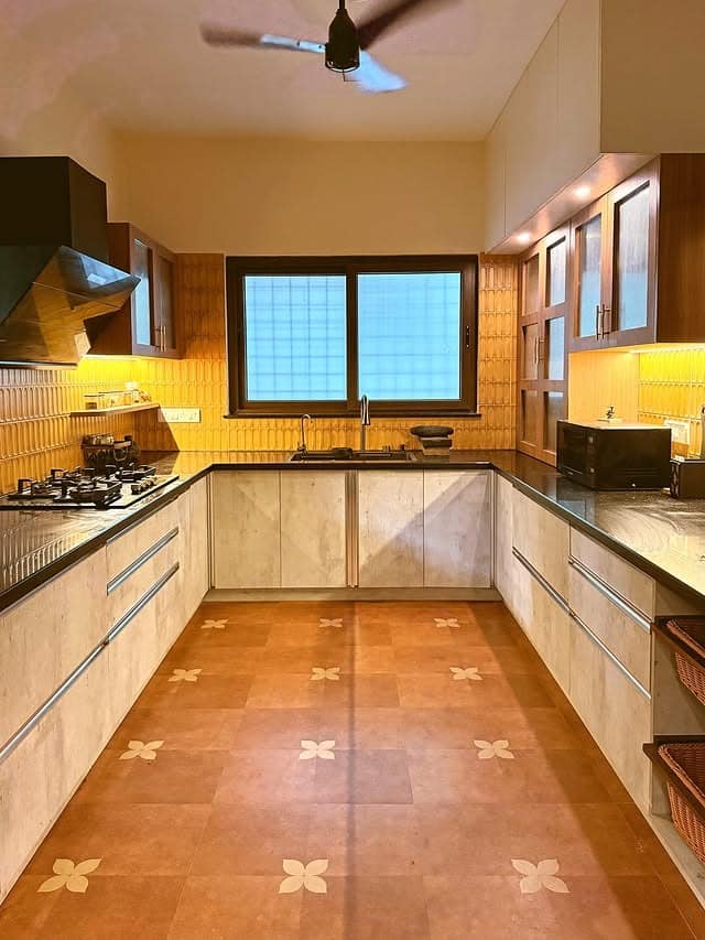 19. Beige and Walnut Traditional Kitchen with Patterned Flooring - traditional kitchen ideas