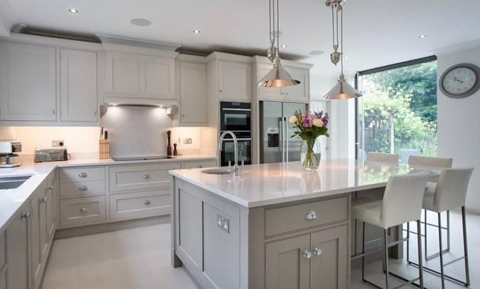 20. Dove Gray Traditional Kitchen with Oversized Island - traditional kitchen ideas