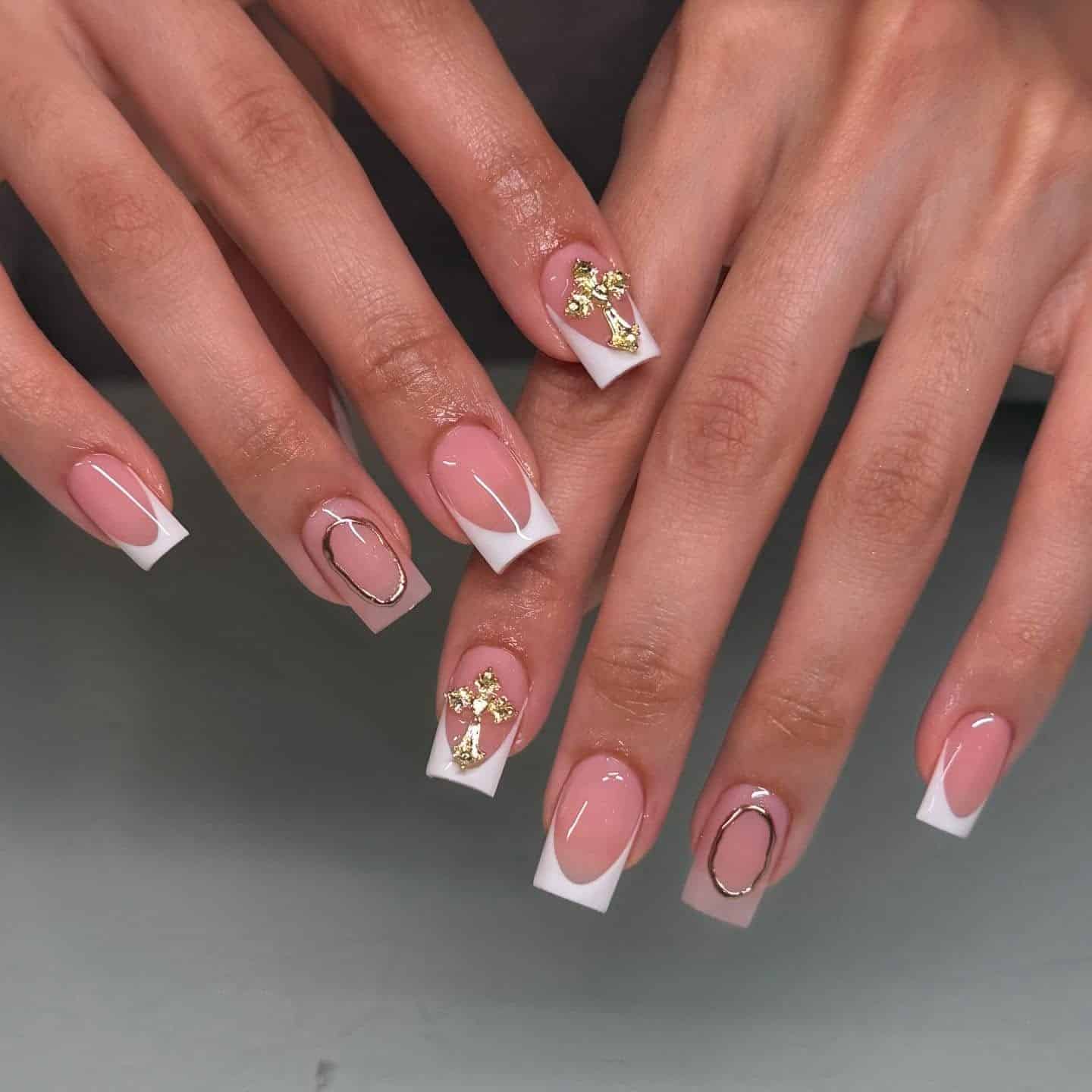 2. White Square French Nails with Gold Cross Accents - classy short nail ideas