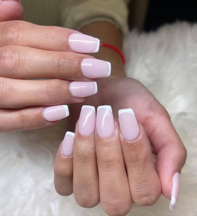 3. Milky Pink Short French Tip Nails - classy short nail ideas