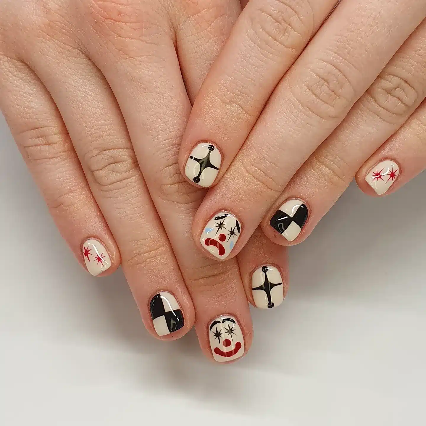 21. Retro Cream and Black Graphic Short Nails - classy short nail ideas